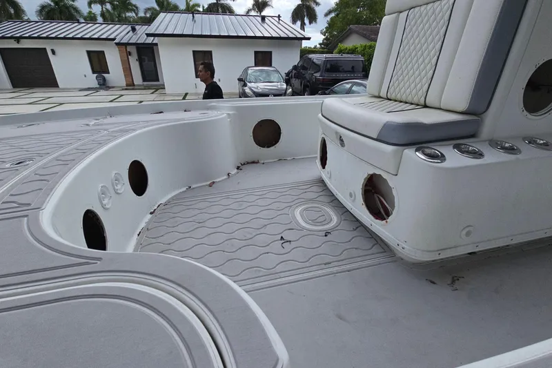 Slide: The Image of 2007 Yellowfin 24 Bay boat interior with seating and cup holders. - 11