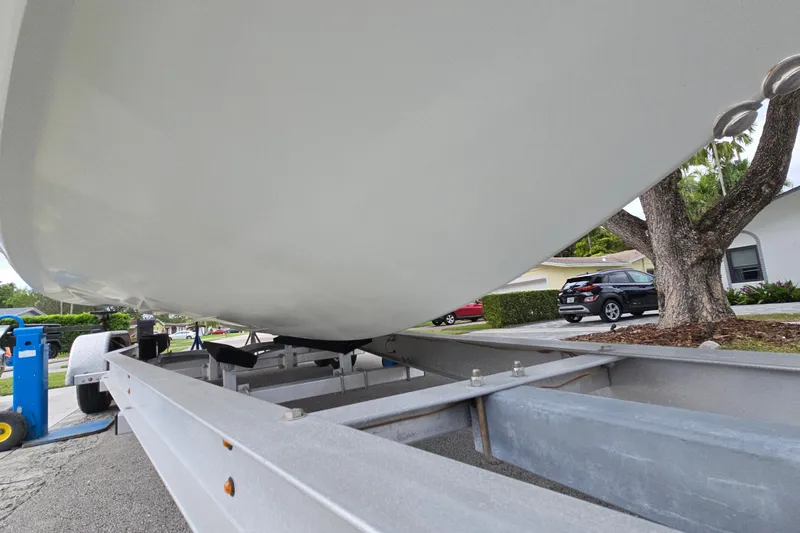 Slide: The Image of 2007 Yellowfin 24 Bay boat on trailer, parked in residential area. - 15