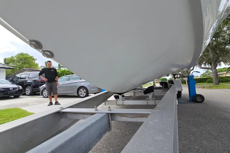 Slide: The Image of 2007 Yellowfin 24 Bay boat on trailer, parked in residential driveway. - 16