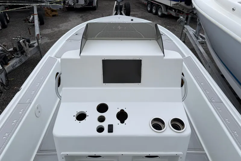 Slide: The Image of 2007 Yellowfin 24 Bay boat console with cup holders and control panel. - 5