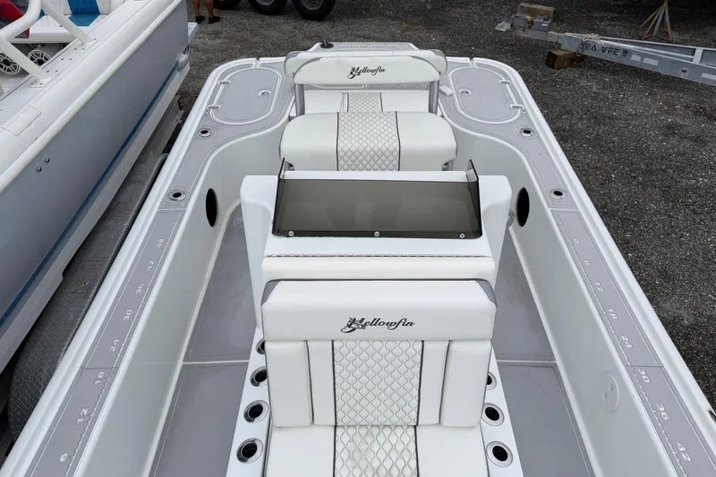 Slide: The Image of 2007 Yellowfin 24 Bay boat interior with white seating and sleek design. - 8