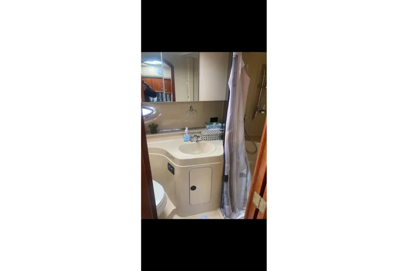 Slide: The Image of Bathroom interior of 2006 Cruisers Yachts 340 Express with sink and shower. - 17