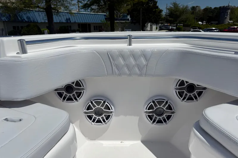 Slide: The Image of Interior of 2026 Contender 39 ST boat with white seating and built-in speakers. - 10