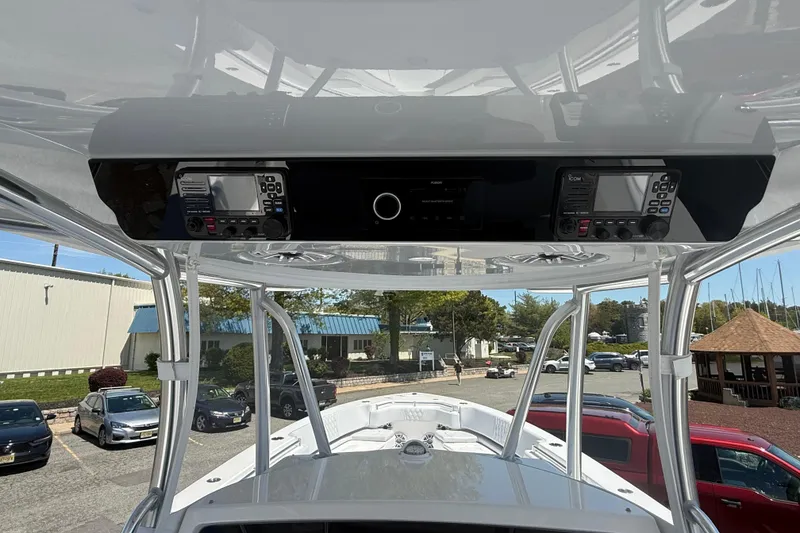Slide: The Image of 2026 Contender 39 ST boat console with advanced navigation equipment and sleek design. - 21