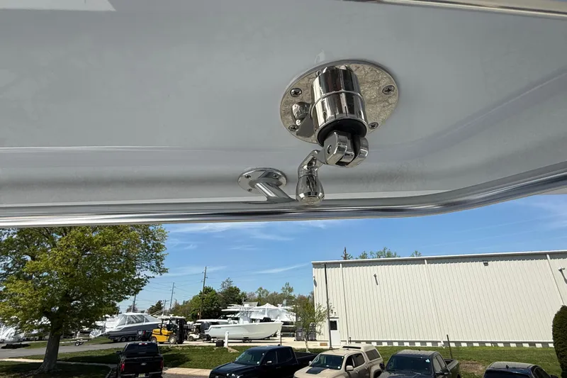 Slide: The Image of 2026 Contender 39 ST boat detail with stainless steel fitting, outdoor setting in background. - 23