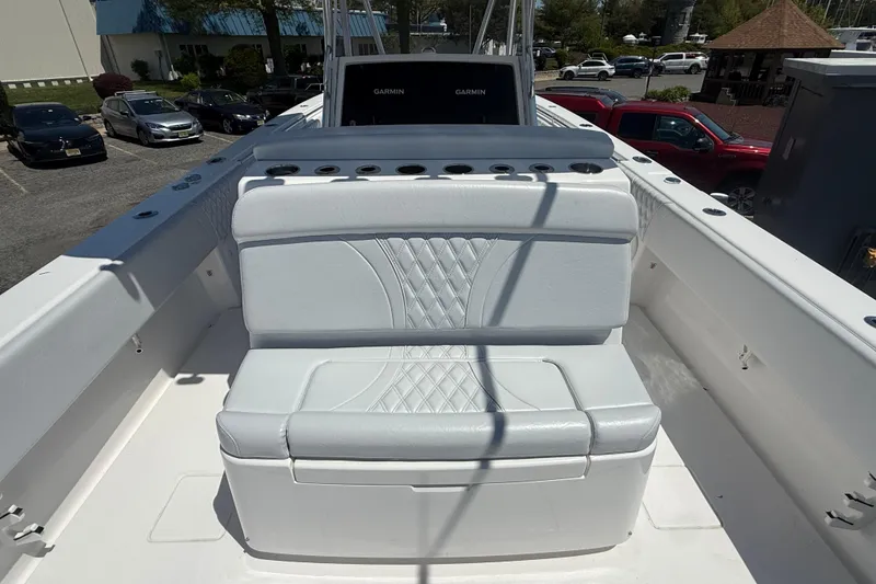 Slide: The Image of 2026 Contender 39 ST boat with white cushioned seating and rod holders. - 24