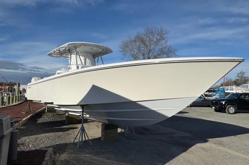 Slide: The Image of 2026 Contender 39 ST boat on display in a marina setting. - 3