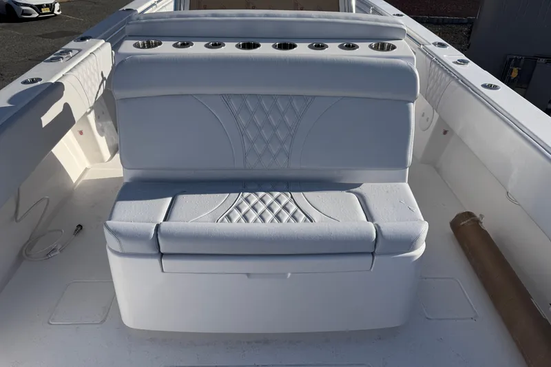 Slide: The Image of 2026 Contender 39 ST boat with white cushioned seating and cup holders. - 5