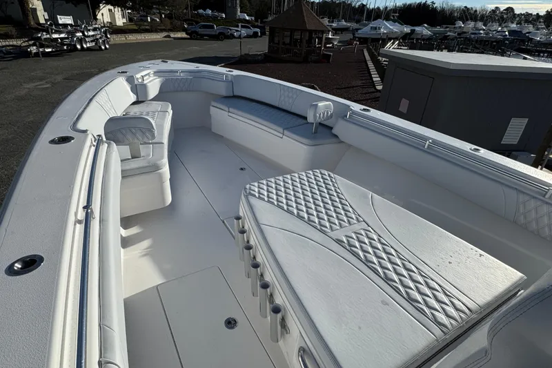 Slide: The Image of 2026 Contender 39 ST boat interior with cushioned seating and spacious deck layout. - 7