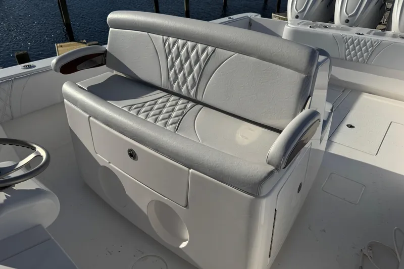 Slide: The Image of Luxury seating on 2026 Contender 39 ST boat, featuring elegant diamond-pattern upholstery. - 9