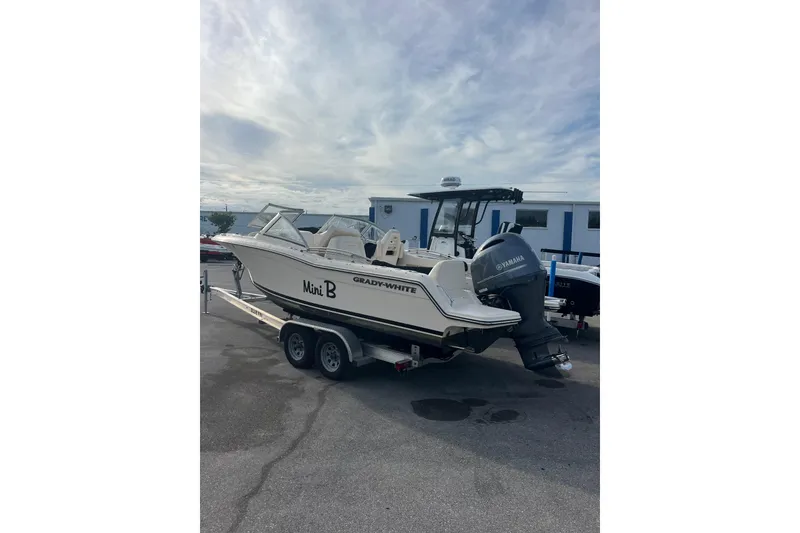 Slide: The Image of 2018 Grady-White Freedom 215 boat on trailer with Yamaha outboard motor. - 2