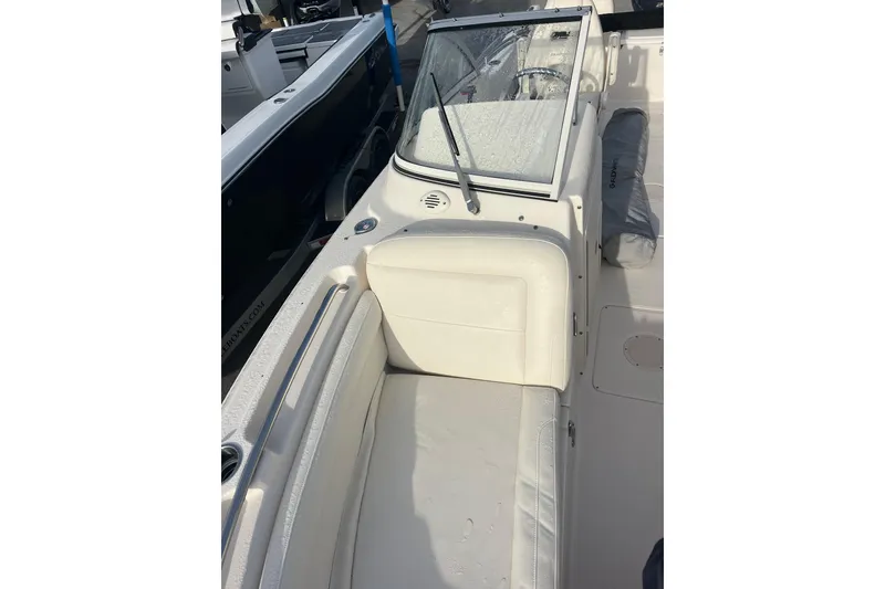 Slide: The Image of 2018 Grady-White Freedom 215 boat interior with seating and windshield. - 5