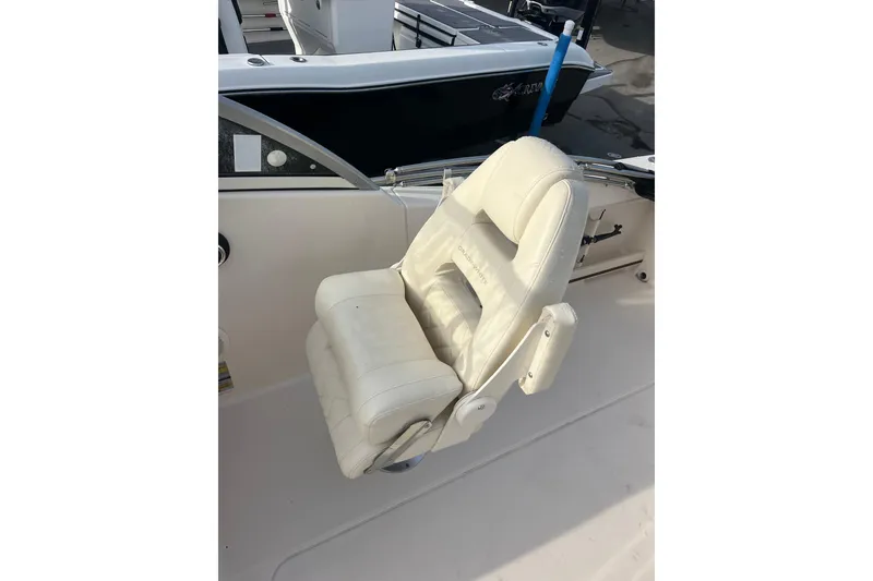 Slide: The Image of White captain's chair on 2018 Grady-White Freedom 215 boat deck. - 8