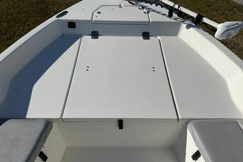 Slide: The Image of 2020 Bay Rider 239 Bay boat deck with storage compartments and seating. - 17