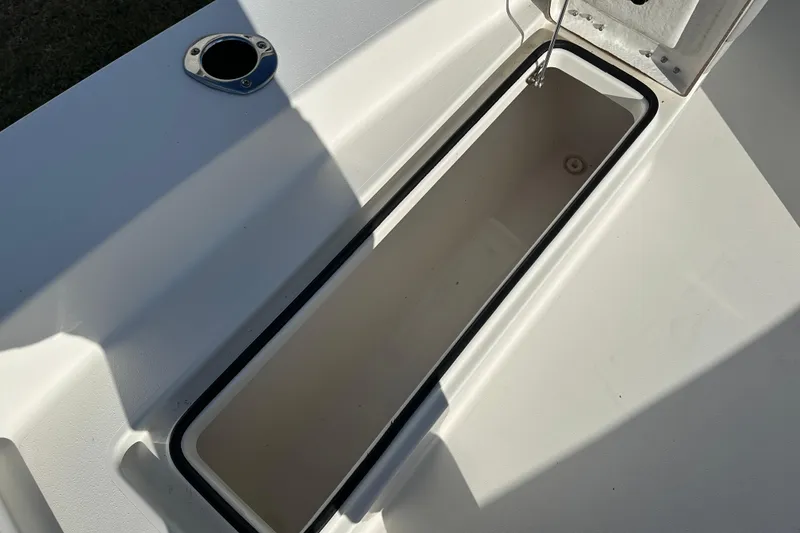Slide: The Image of Open storage compartment on a 2020 Bay Rider 239 Bay boat. - 21