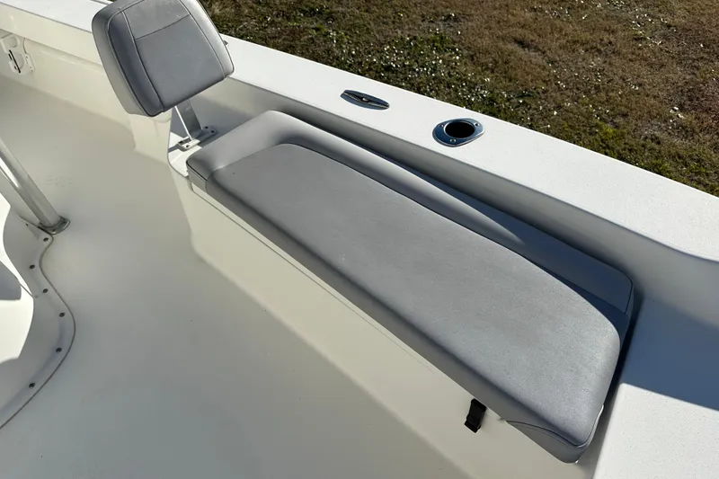 Slide: The Image of 2020 Bay Rider 239 Bay boat interior with gray seating and rod holder. - 22