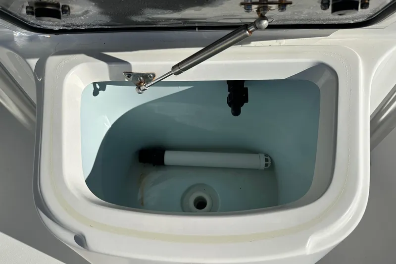 Slide: The Image of Open livewell compartment on 2020 Bay Rider 239 Bay boat, showing interior details. - 26
