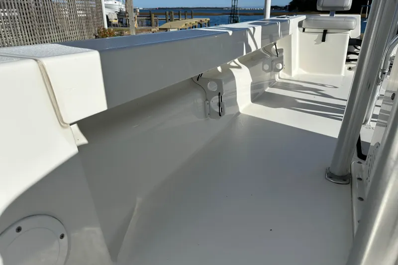 Slide: The Image of 2020 Bay Rider 239 Bay boat interior with clean white deck and seating. - 29
