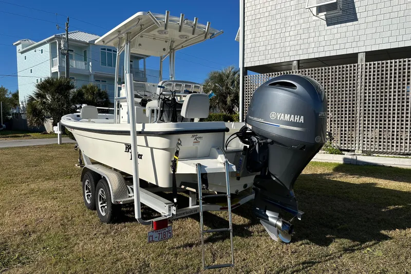 Slide: The Image of 2020 Bay Rider 239 Bay boat with Yamaha engine on trailer, parked outdoors. - 3
