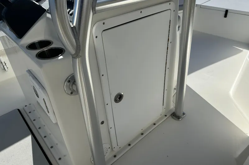 Slide: The Image of 2020 Bay Rider 239 Bay boat console with storage compartment and cup holders. - 30
