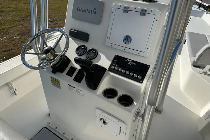 Slide: The Image of 2020 Bay Rider 239 Bay boat console with Garmin navigation and steering wheel. - 34