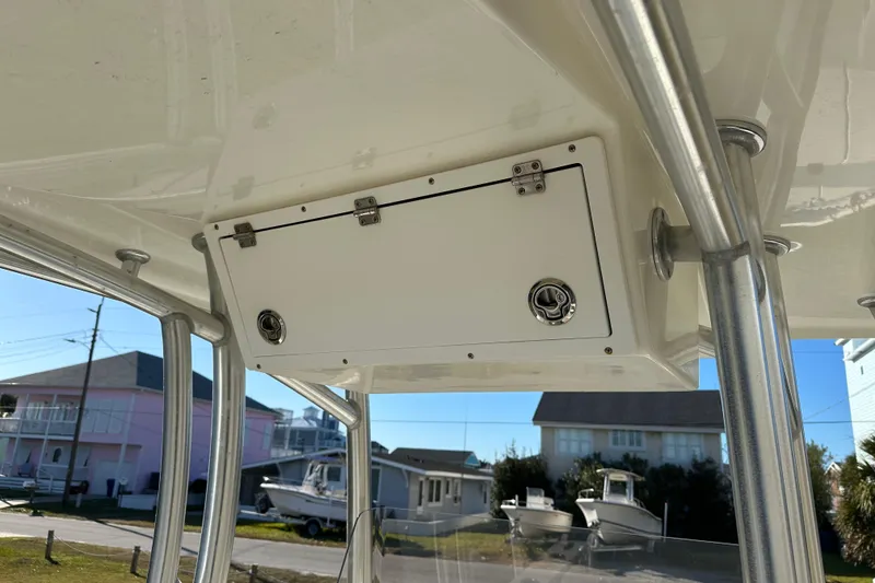 Slide: The Image of 2020 Bay Rider 239 Bay boat with overhead storage compartment and metal supports. - 35