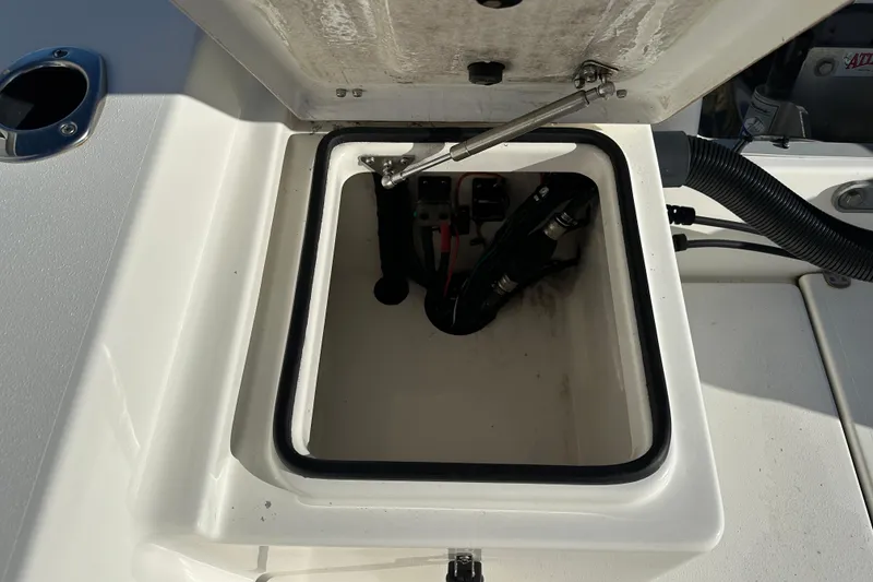 Slide: The Image of Open storage compartment on 2020 Bay Rider 239 Bay boat, showing internal components. - 46