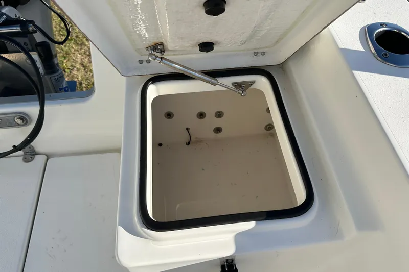 Slide: The Image of Open storage compartment on 2020 Bay Rider 239 Bay boat, showcasing interior details. - 47