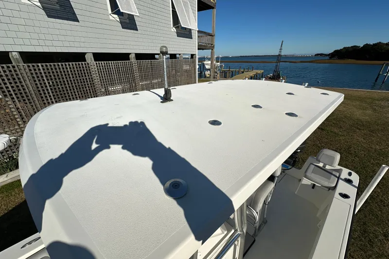 Slide: The Image of 2020 Bay Rider 239 Bay boat docked near waterfront home, sunny day. - 49