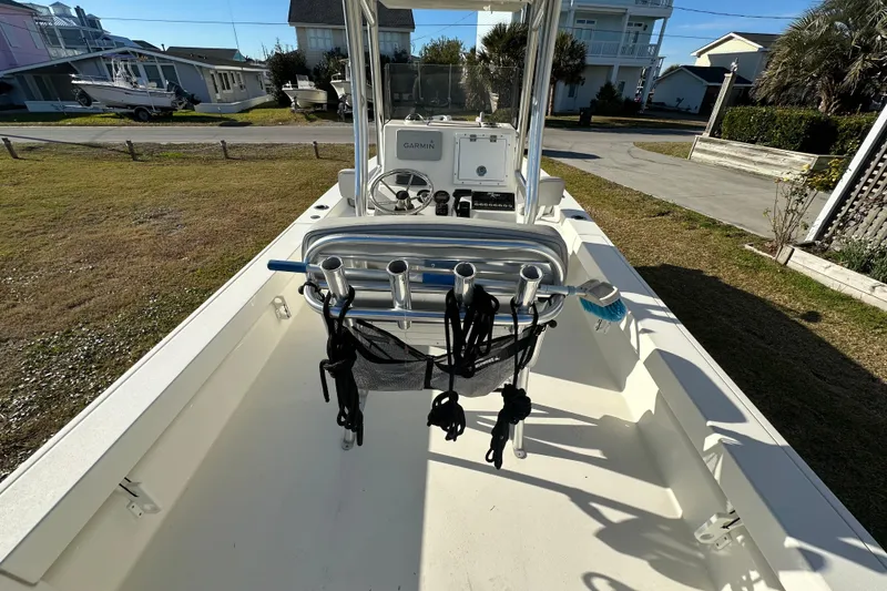 Slide: The Image of 2020 Bay Rider 239 Bay boat interior with steering console and rod holders. - 50