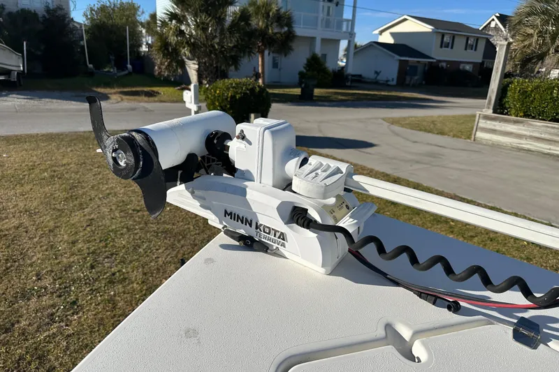 Slide: The Image of Minn Kota trolling motor on 2020 Bay Rider 239 Bay boat, parked in residential area. - 52