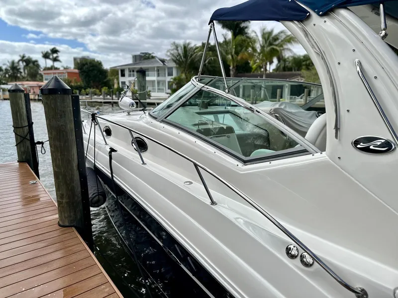 Slide: The Image of 2008 Sea Ray 340 Sundancer docked, featuring sleek design and luxurious amenities. - 11