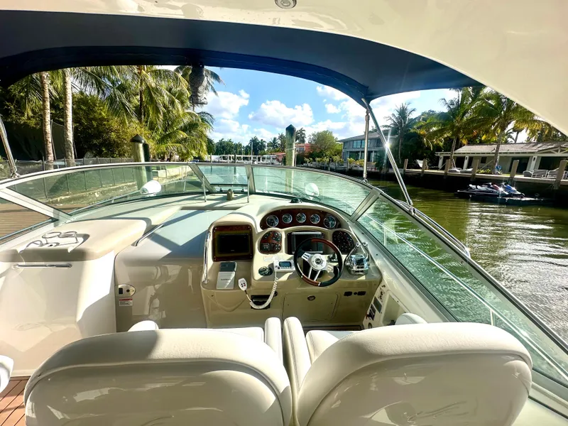 Slide: The Image of Helm of 2008 Sea Ray 420 Sundancer yacht with tropical waterfront view. - 25