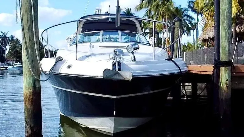 Slide: The Image of 2008 Sea Ray 420 Sundancer yacht docked in a tropical marina setting. - 8
