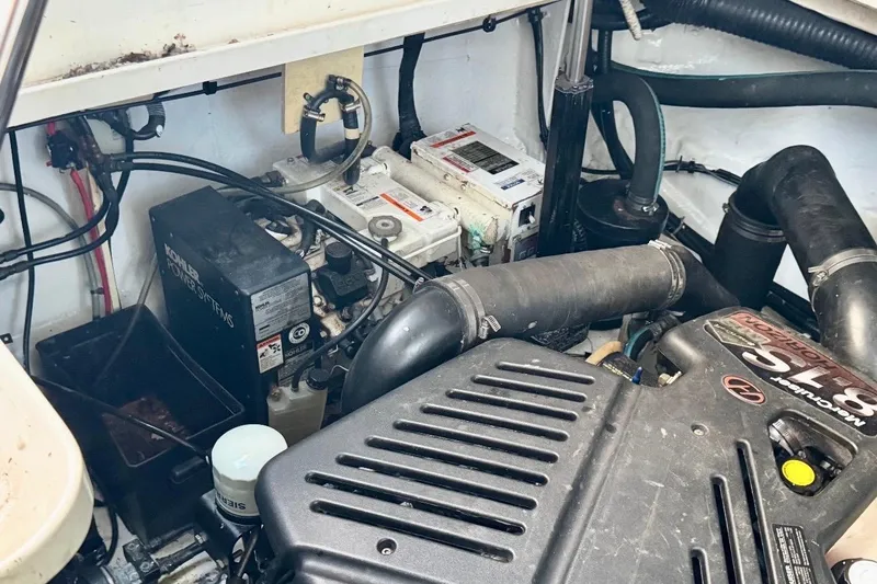 Slide: The Image of Engine compartment of a 2008 Sea Ray 340 Sundancer with visible components and wiring. - 89