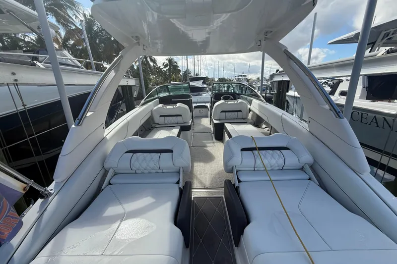 Slide: The Image of 2022 Regal LX6 boat interior with luxurious seating and modern design. - 14