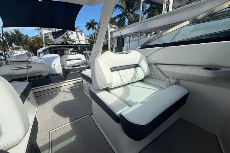Slide: The Image of 2022 Regal LX6 boat interior with luxurious white seating and modern design. - 15