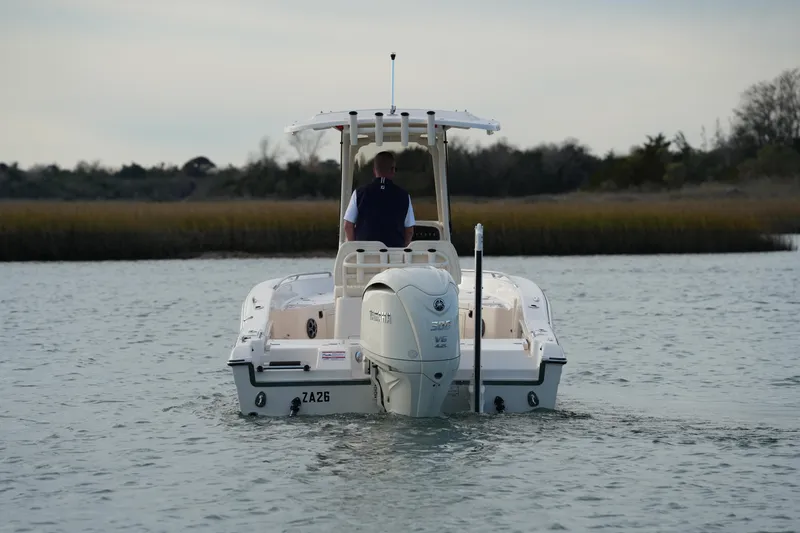 Slide: The Image of 2026 Grady-White 251 Coastal Explorer boat navigating calm waters. - 15