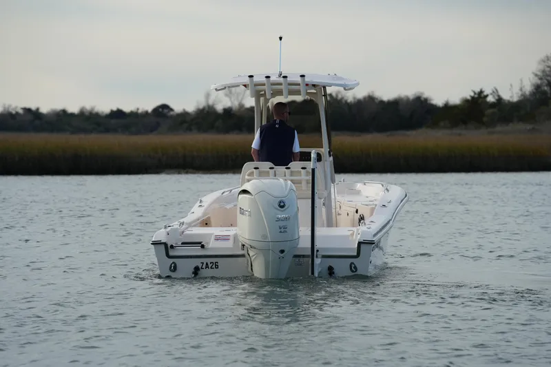 Slide: The Image of 2026 Grady-White 251 Coastal Explorer boat navigating calm waters. - 16