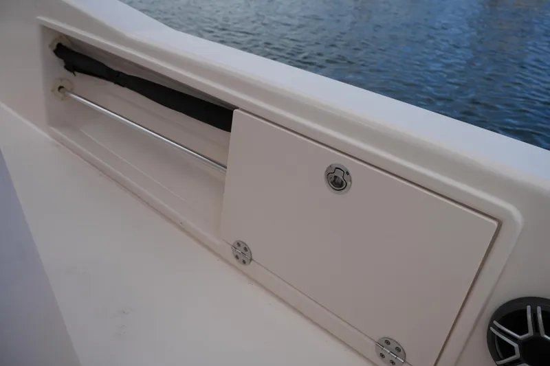 Slide: The Image of 2026 Grady-White 251 Coastal Explorer boat storage compartment detail. - 22