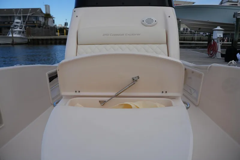 Slide: The Image of 2026 Grady-White 251 Coastal Explorer boat interior with open storage compartment. - 35