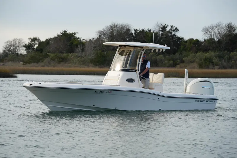 Slide: The Image of 2026 Grady-White 251 Coastal Explorer boat on calm water, side view. - 7