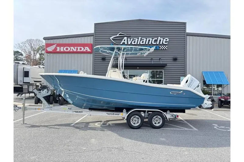 The Image of 2026 Bulls Bay 230 Center Console boat on trailer outside dealership. - 1