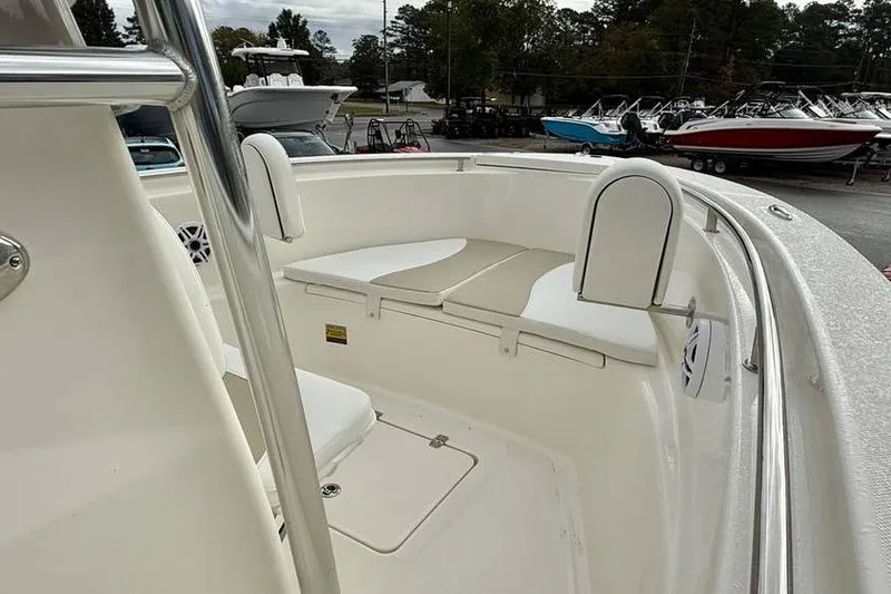 Slide: The Image of 2026 Bulls Bay 230 Center Console boat interior with cushioned seating. - 11