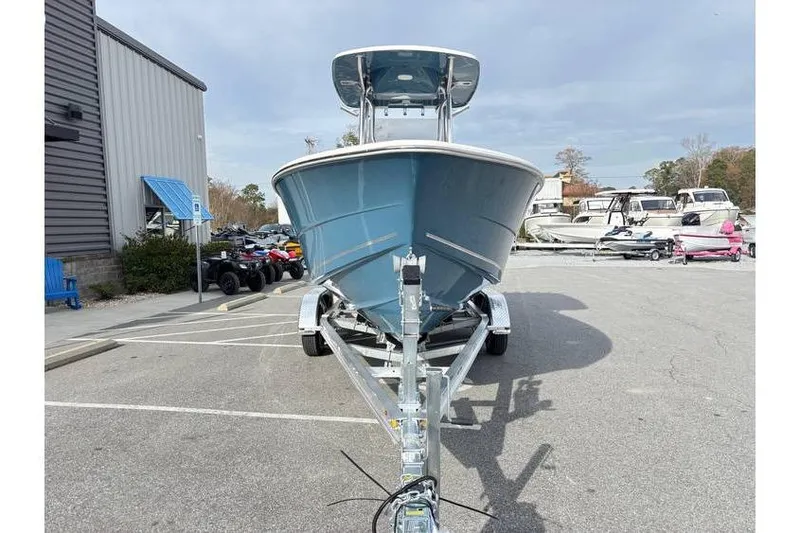 Slide: The Image of 2026 Bulls Bay 230 Center Console boat on trailer in parking lot. - 2