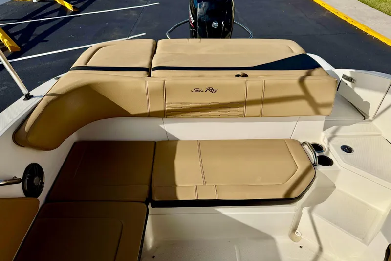 Slide: The Image of 2022 Sea Ray SPX 210 Outboard boat interior with tan seating and sleek design. - 24