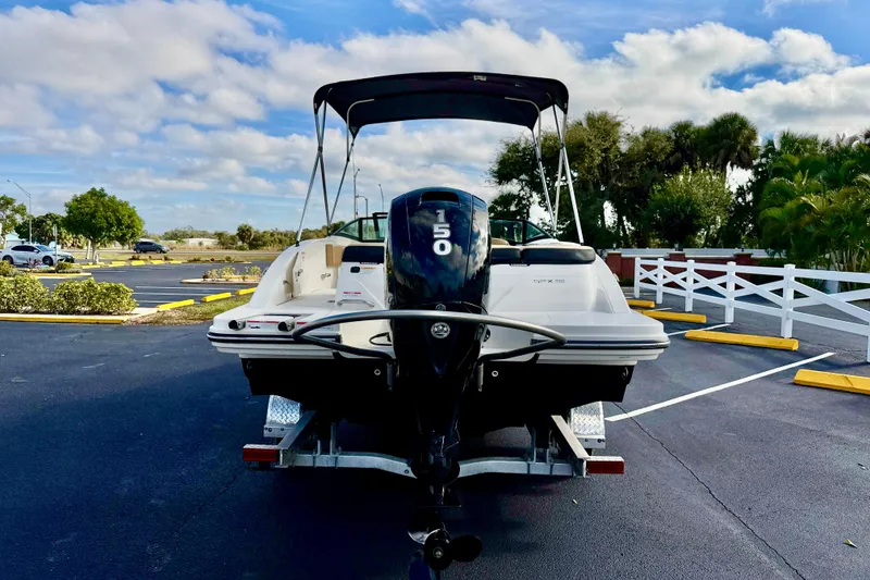 Slide: The Image of 2022 Sea Ray SPX 210 Outboard boat on trailer in parking lot. - 5