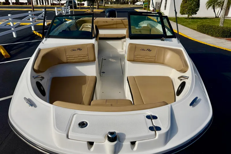 Slide: The Image of 2022 Sea Ray SPX 210 Outboard boat with tan seating and sleek design. - 8