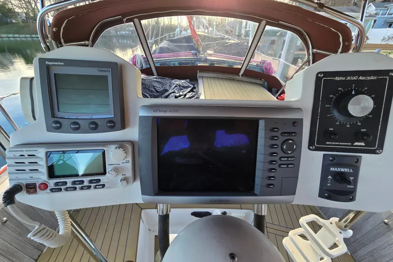 Slide: The Image of Cockpit of 1986 Hans Christian 38T sailboat with navigation instruments and controls. - 14