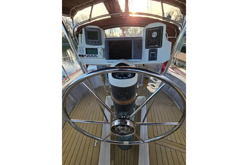 Slide: The Image of Cockpit of 1986 Hans Christian 38T sailboat with steering wheel and navigation instruments. - 15